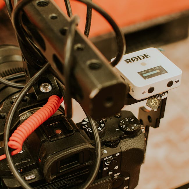 Detailed view of a camera setup with Rode microphone and cables, ideal for professional photography.